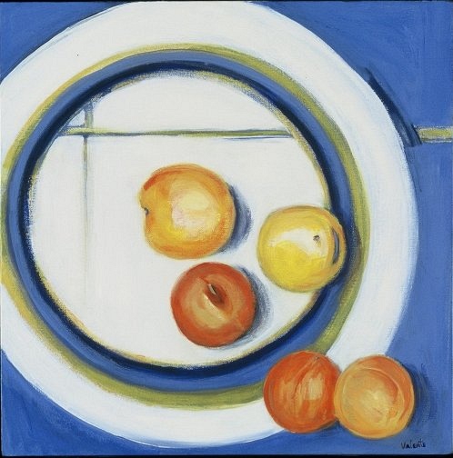 white plate with orange and yellow fruit